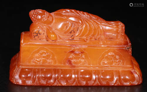 AN OLD BEESWAX SLEEPING BUDDHA