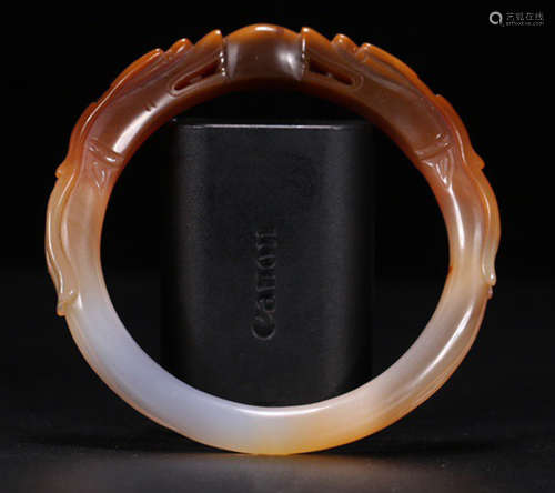 AN AGATE BANGLE CARVED WITH DRAGON