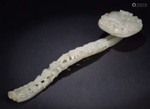 AN OLD HETIAN JADE RUYI CARVED WITH FLOWER
