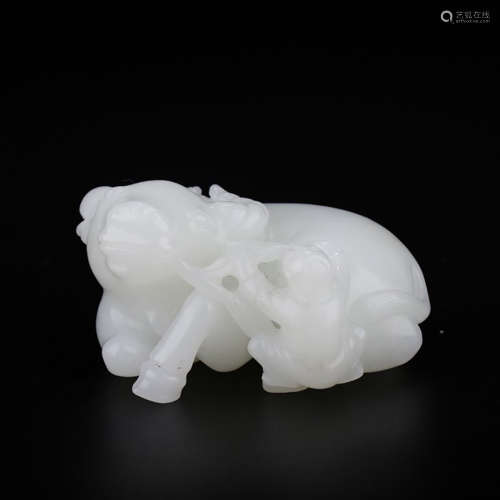 A CHINESE HETIAN JADE CARVED OX ORNAMENT