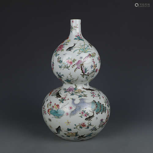 A CHINESE FAMILLE ROSE BUTTERFLY PAINTED PORCELAIN GOURD-SHAPED VASE