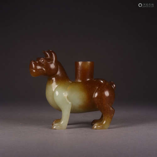 A CHINESE HETIAN JADE CARVED BEAST SHAPED CANDLESTICK