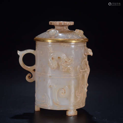 A CHINESE JADE CARVED CHI DRAGON PATTERN CUP WITH COVER