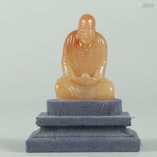 A CHINESE SHOUSHAN STONE CARVED SEATED ARHAT ORNAMENT