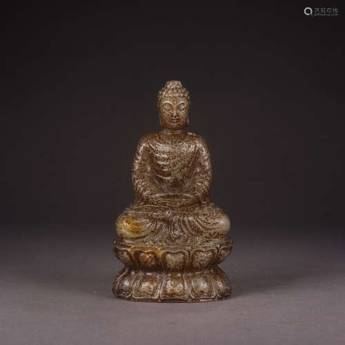 A CHINESE HETIAN JADE CARVED STATUE OF SAKYAMUNI