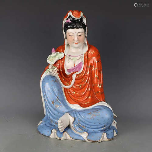 A CHINESE PORCELAIN GUANYIN STATUE