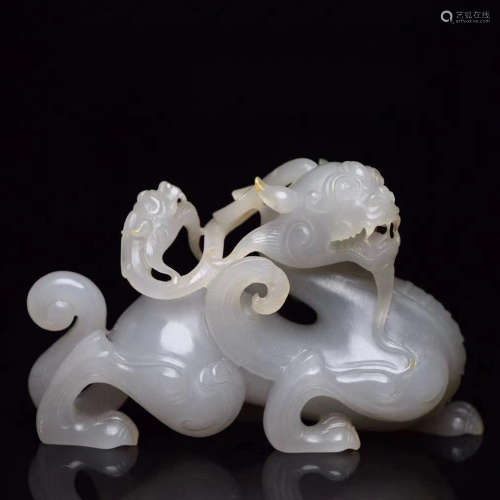 A CHINESE JADE CARVED DRAGON ORNAMENT