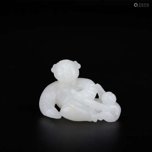 A CHINESE WHITE HETIAN JADE CARVED BOY ORNAMENT