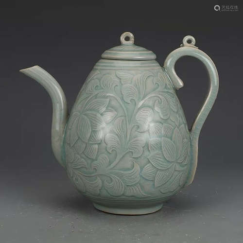 A CHINESE CELADON FLORAL CARVED PORCELAIN POT