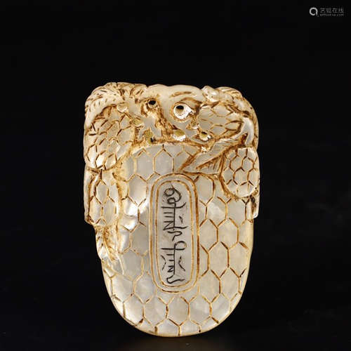 A CHINESE SHELL PENDANT