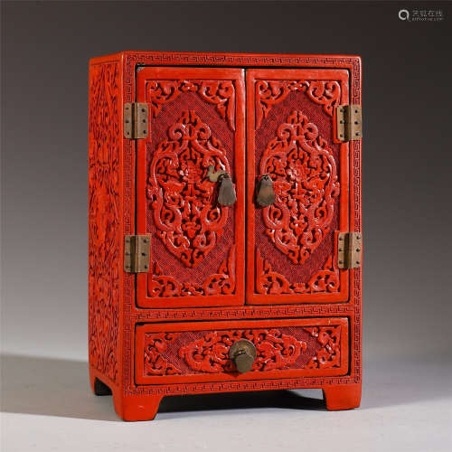 A CHINESE CARVED RED LACQUERWARE CABINET