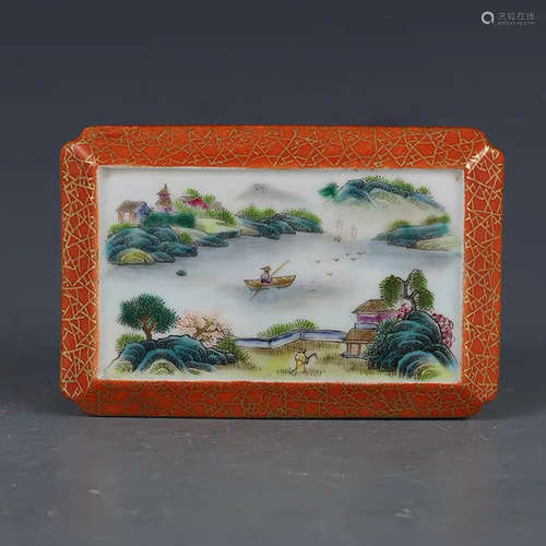 A CHINESE RED FAMILLE ROSE LANDSCAPE PORCELAIN PAPER WEIGHT