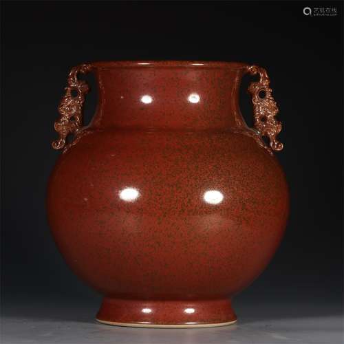 A QING QIANLONG DYNASTY RUSTY RED GLAZE JAR WITH TWO EARS