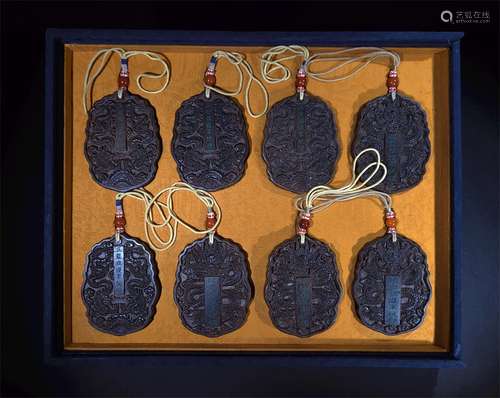 A SET OF QING DYNASTY AGARWOOD TOKENS