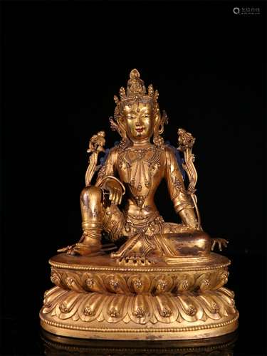 A MING DYNASTY BRONZE GILDED GUANYIN