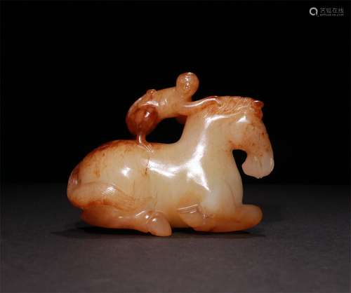 A QING DYNASTY HETIAN JADE MONKEY AND HORSE ORNAMENT