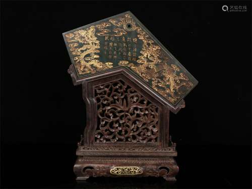 A QING DYNASTY HETIAN GREEN JADE WITH GOLDEN DRAGON CHIME STONE