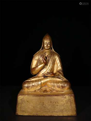 A MING DYNASTY BRONZE GILDED GURU BUDDHA