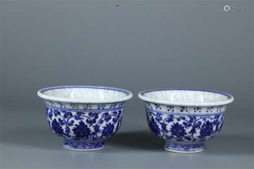 A PAIR OF YONGLE DYNASTY BLUE AND WHITE INTERLOCK BRANCH LOTUS CUPS, OPEN