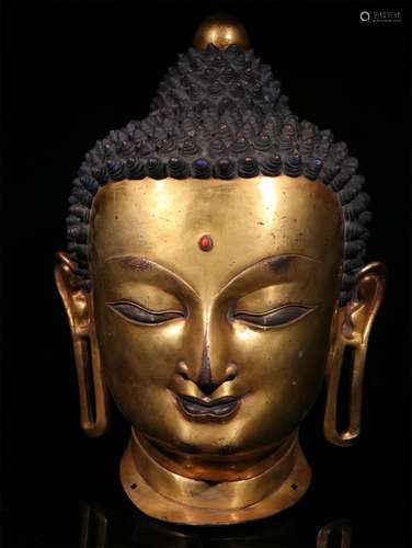 A MING DYNASTY BRONZE GILDED BUDDHA HEAD