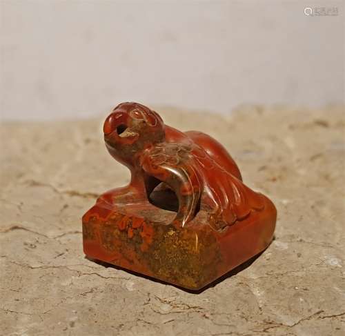A WARRING STATES PERIOD NANJIANG RED AGATE BIRD SEAL