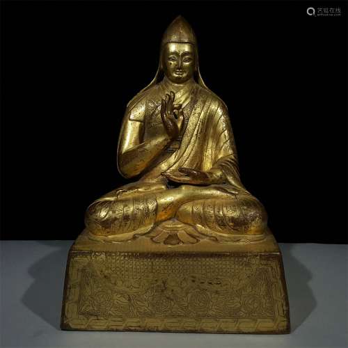 A MING DYNASTY BRONZE GILDED STATUE
