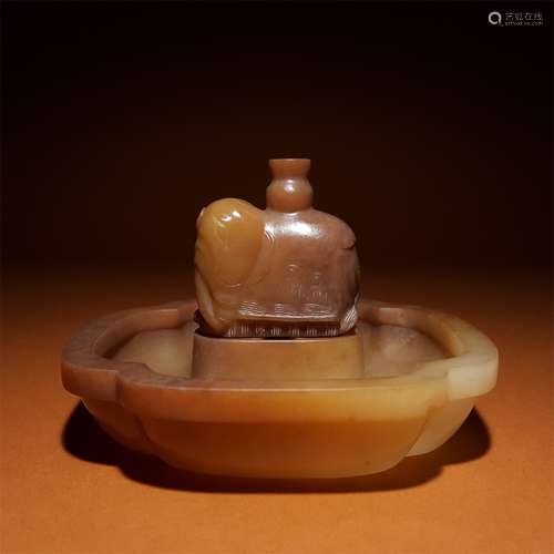 A QING DYNASTY HETIAN JADE ELEPHANT INCENSE HOLDER BASE