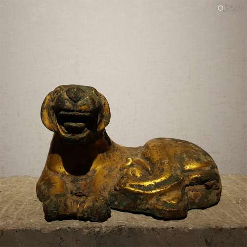 A WARRING STATES PERIOD BRONZE GILDED GOLD BEAST