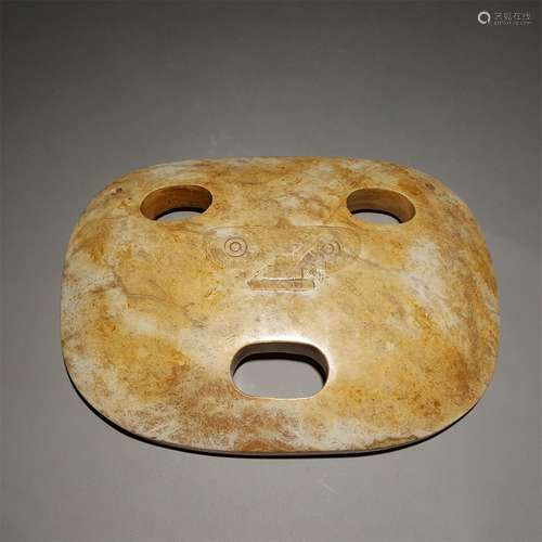 A SHANG DYNASTY JADE MASK