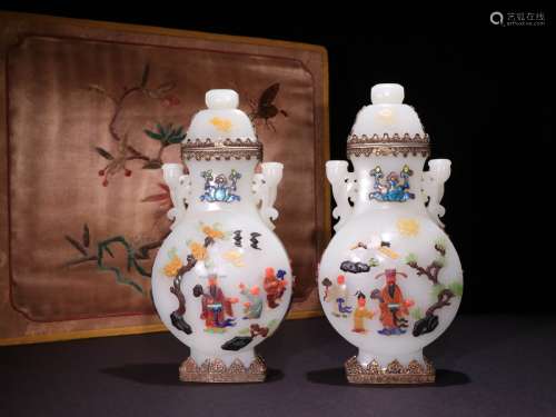 A PAIR OF QING DYNASTY WHITE JADE BOTTLES INLAID WITH HUNDRED TREASURES