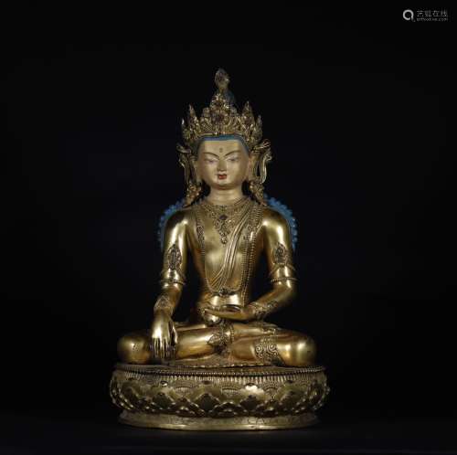 A MING DYNASTY BRONZE GILDED FEMALE STATUE