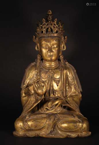 A MING DYNASTY BRONZE GILDING GUANYIN