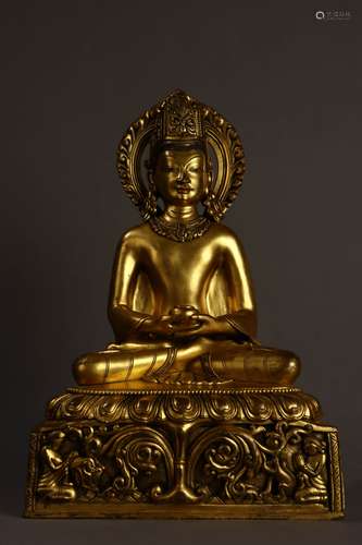 A MING DYNASTY BRONZE GILDING GUANYIN