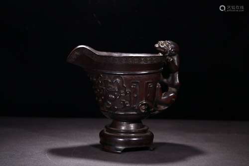 A Chinese Rosewood Vessel With Dragon Carving