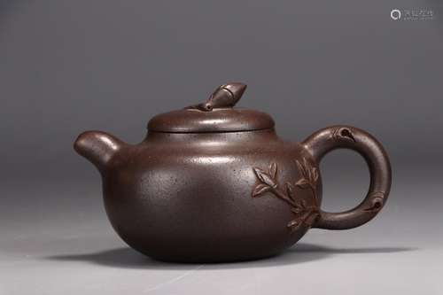 A Chinese Zisha Teapot With Flower Pattern