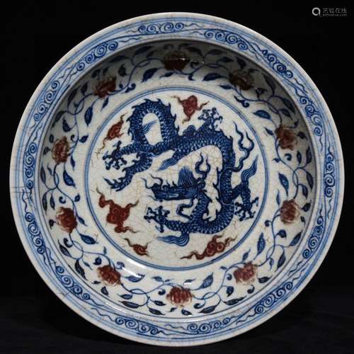 A Chinese Blue And White Underglaze Red Plate With Dragon Carving