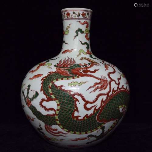 A Chinese Cai Bottle Vase With Dragon Carving