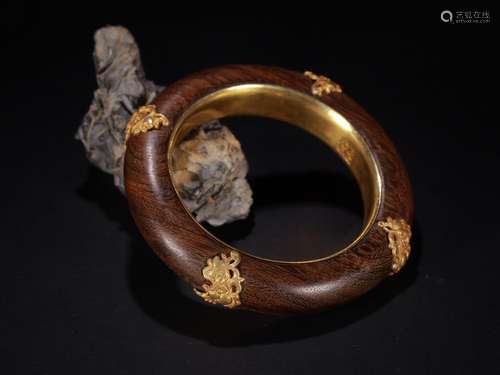 A Chinese Chenxiang Wood Gilt Bronze Bangle With Pattern