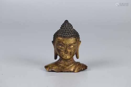 A Chinese Gilt Bronze Buddha Head