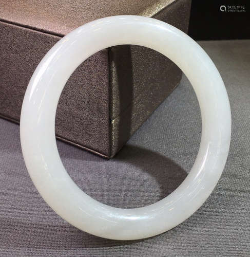 A HETIAN JADE CARVED BANGLE