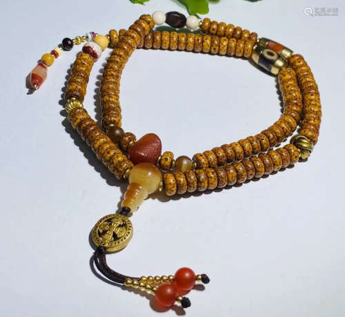 A HAINAN BODHI CARVED NECKLACE