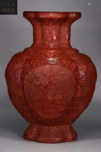 A RED LACQUER VASE WITH FLOWER PATTERN