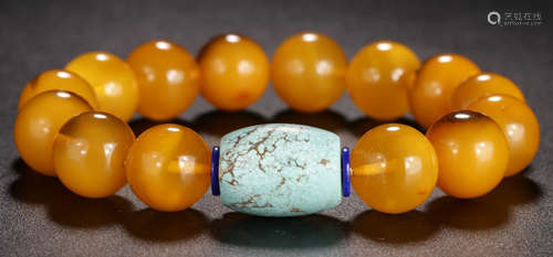 A BALTIC SEA BEESWAX BRACELET WITH TURQUOISE