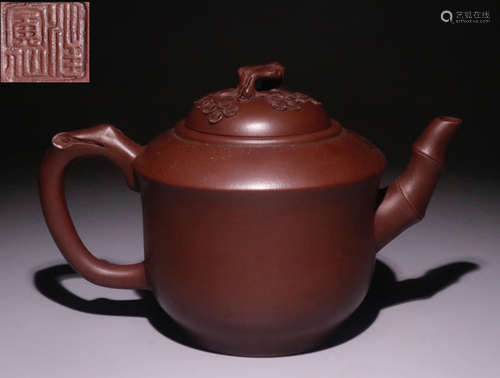 A ZISHA TEA POT WITH PLANT PATTERN