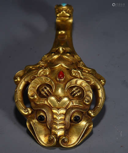 A GILT BRONZE PENDANT WITH BEAST PATTERN