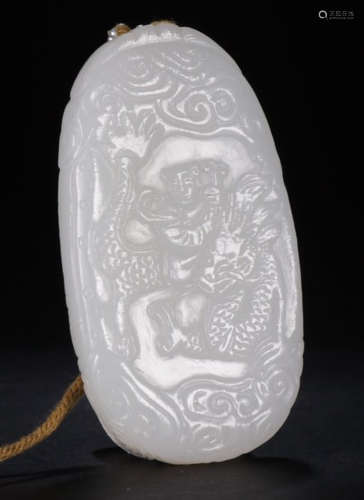 A HETIAN WHITE JADE PENDANT CARVED WITH QILIN