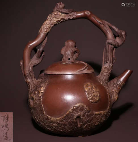 A ZISHA TEA POT CARVED WITH MONKEY