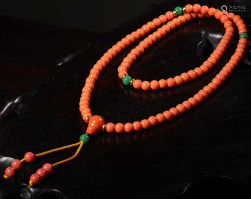 A GLASS STRING NECKLACE WITH 108 BEADS