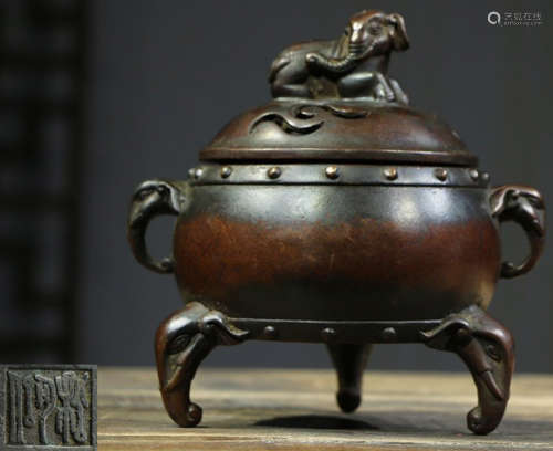 A COPPER CENSER WITH BEAST COVER