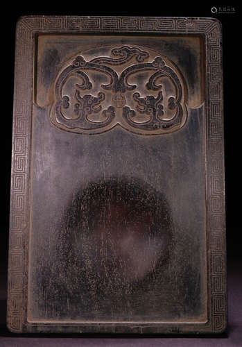 AN INK SLAB CARVED WITH BEAST PATTERN